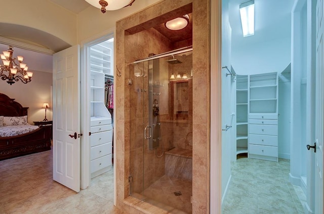 71 Omaha Ave, Clovis, CA 93619 - ensuite bathroom featuring a spacious closet, a stall shower, and a chandelier
