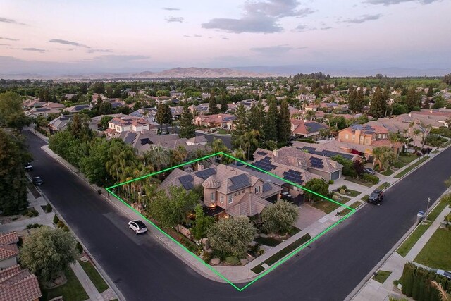 71 Omaha Ave, Clovis, CA 93619 - aerial perspective of suburban area with property boundaries highlighted and a mountainous background