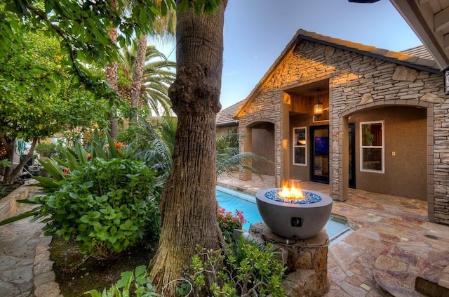 71 Omaha Ave, Clovis, CA 93619 - view of patio with a fire pit