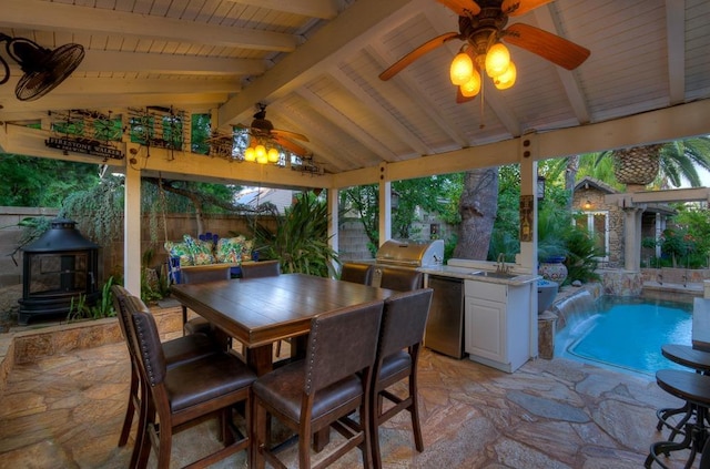 view of patio / terrace with a sink, grilling area, a fenced backyard, exterior kitchen, and a gazebo