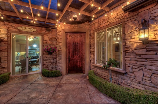 entrance to property with stone siding