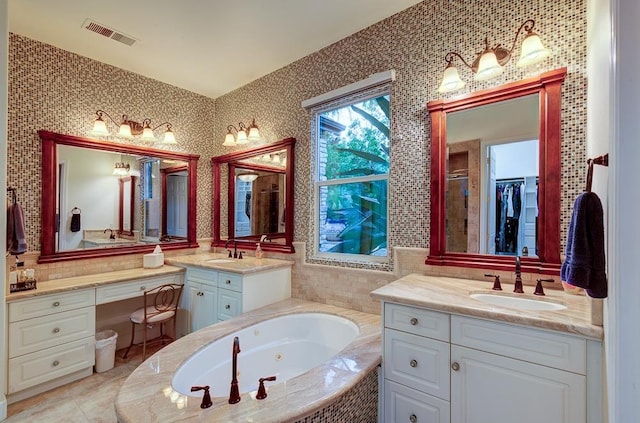 71 Omaha Ave, Clovis, CA 93619 - full bathroom featuring two vanities and a jetted tub
