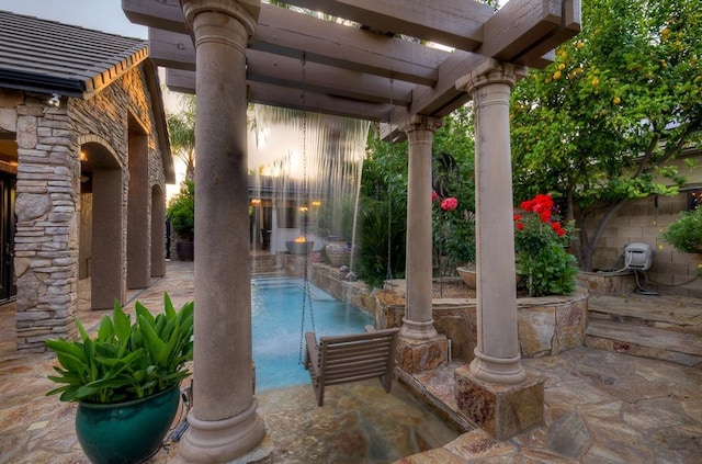 pool with a pergola and a patio area