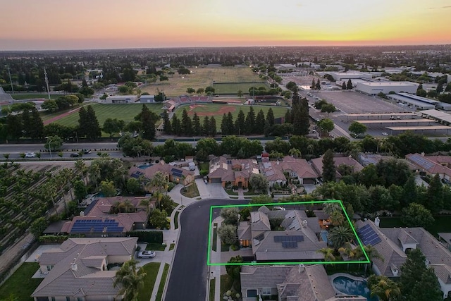 71 Omaha Ave, Clovis, CA 93619 - aerial view at dusk of property parcel outlined and a residential view