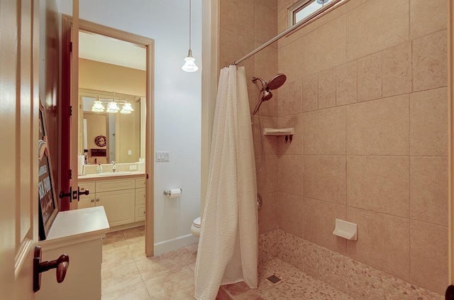 71 Omaha Ave, Clovis, CA 93619 - full bath with tiled shower, vanity, tile patterned floors, and toilet