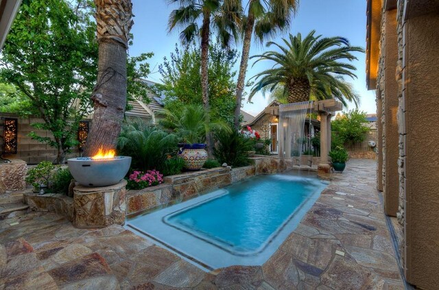 71 Omaha Ave, Clovis, CA 93619 - view of pool featuring a patio, a fenced backyard, and an outdoor structure