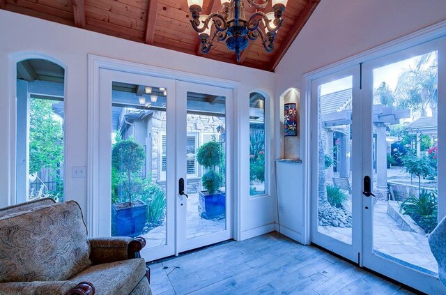 71 Omaha Ave, Clovis, CA 93619 - doorway to outside featuring french doors, wood ceiling, light wood-type flooring, and a chandelier