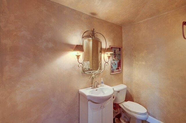 71 Omaha Ave, Clovis, CA 93619 - bathroom with vanity, toilet, and baseboards