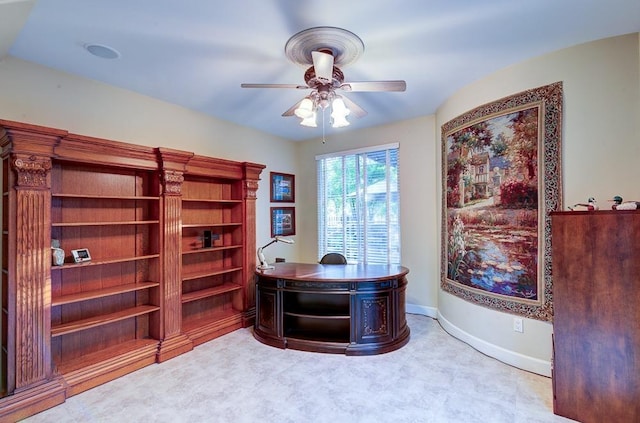 office featuring ceiling fan and baseboards