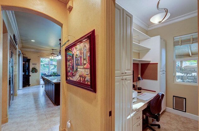 71 Omaha Ave, Clovis, CA 93619 - corridor with ornamental molding, an office area, light tile patterned floors, arched walkways, and baseboards