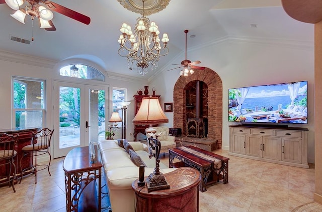 living room with visible vents, a ceiling fan, vaulted ceiling, and a wood stove