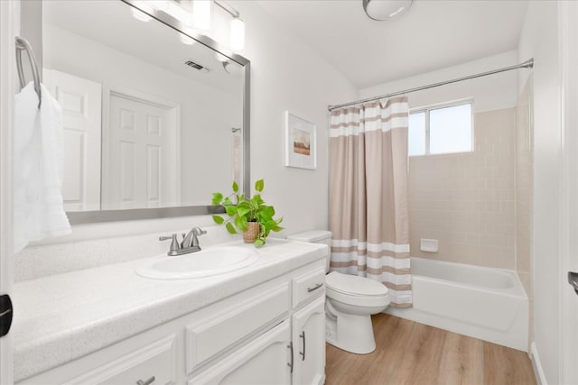42968 Ranger Circle Dr, Coarsegold, CA 93614 - bathroom featuring visible vents, vanity, wood finished floors, shower / bath combination with curtain, and toilet