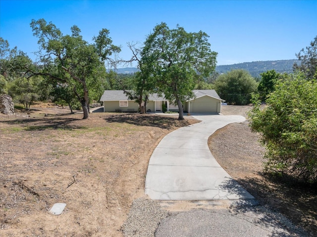 42968 Ranger Circle Dr, Coarsegold, CA 93614 - view of front facade with concrete driveway and a garage