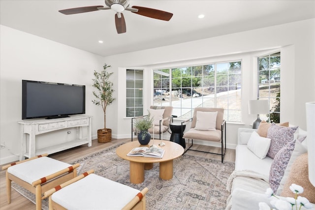 42968 Ranger Circle Dr, Coarsegold, CA 93614 - living area featuring a ceiling fan, baseboards, a healthy amount of sunlight, and wood finished floors