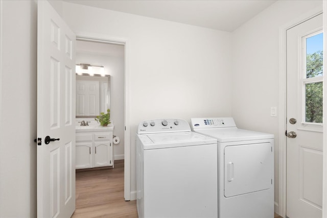 42968 Ranger Circle Dr, Coarsegold, CA 93614 - laundry area featuring washer and dryer, laundry area, a sink, and light wood finished floors
