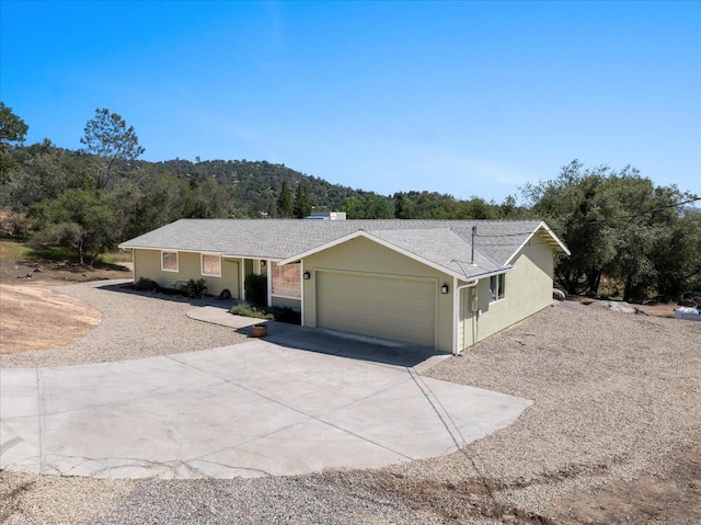 42968 Ranger Circle Dr, Coarsegold, CA 93614 - ranch-style house featuring an attached garage and driveway