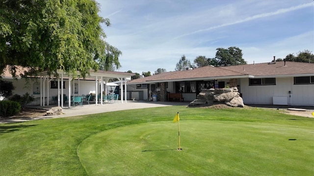 42968 Ranger Circle Dr, Coarsegold, CA 93614 - back of house featuring a lawn, a patio area, and golf course view