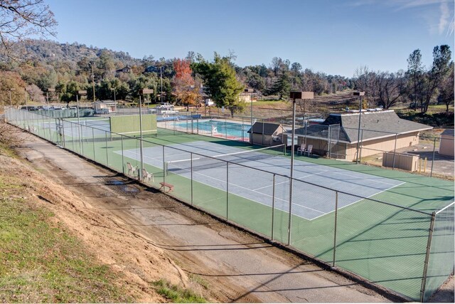 42968 Ranger Circle Dr, Coarsegold, CA 93614 - view of tennis court featuring a swimming pool and fence