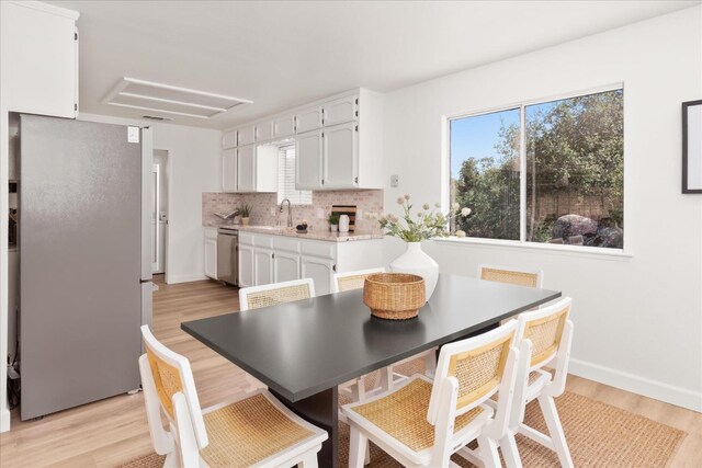 42968 Ranger Circle Dr, Coarsegold, CA 93614 - dining space with light wood-style floors, baseboards, and visible vents