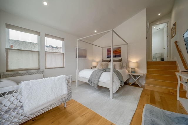 bedroom featuring recessed lighting, baseboards, and wood finished floors