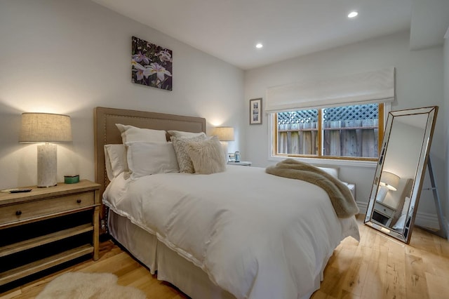 bedroom featuring recessed lighting and wood finished floors