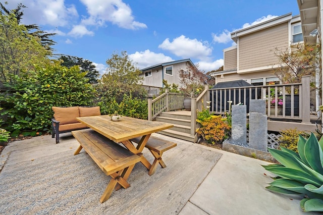 view of patio / terrace with outdoor dining area and fence