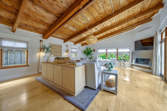 living area featuring an inviting chandelier, wooden ceiling, vaulted ceiling with beams, and light wood finished floors