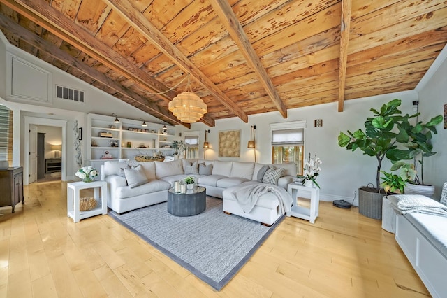 living area featuring a notable chandelier, lofted ceiling with beams, light wood-style flooring, visible vents, and wood ceiling