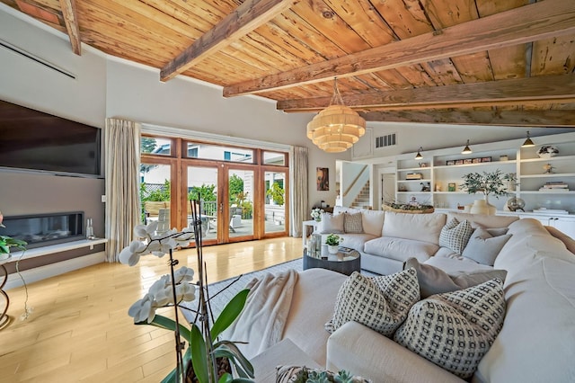 living area with wood-type flooring, stairs, beam ceiling, wood ceiling, and a chandelier