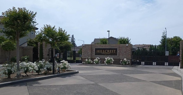 community sign featuring a gate