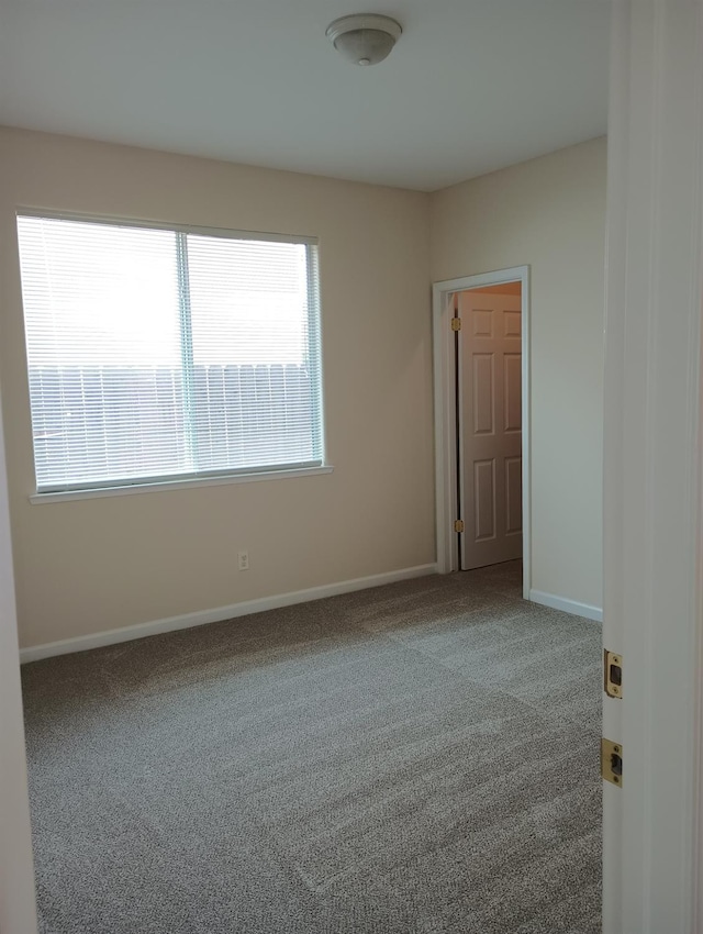 2979 Duncan Ave, Clovis, CA 93611 - carpeted empty room with healthy amount of natural light and baseboards