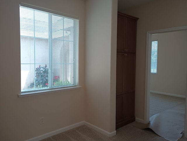 2979 Duncan Ave, Clovis, CA 93611 - unfurnished bedroom with light colored carpet, multiple windows, baseboards, and a closet