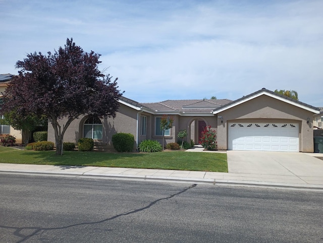 2979 Duncan Ave, Clovis, CA 93611 - ranch-style house featuring stucco siding, a garage, driveway, and a front yard