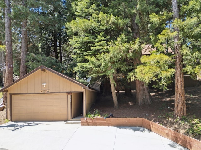 view of front of property with a garage and an outdoor structure