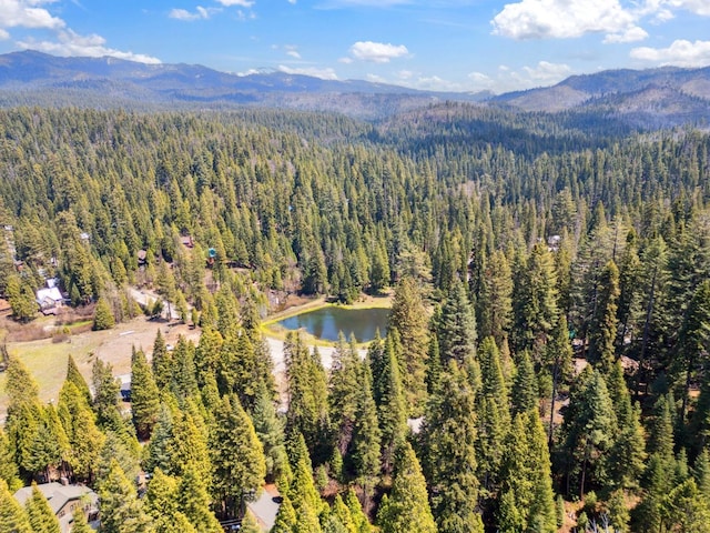 aerial view with a view of trees and a water and mountain view