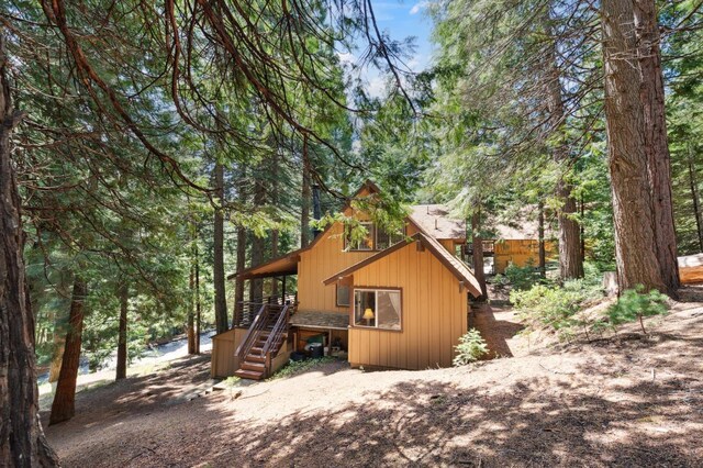 1167 Silver Tip Ln, Fish Camp, CA 93623 - back of property featuring stairway and a wooden deck