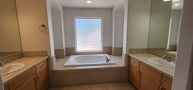 5360 E Heaton Ave, Fresno, CA 93727 - full bath with healthy amount of natural light, two vanities, and a whirlpool tub