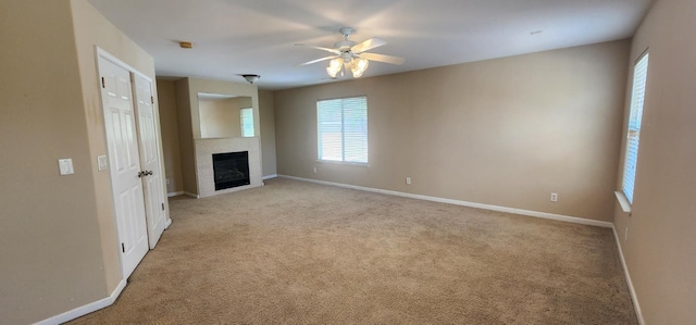 5360 E Heaton Ave, Fresno, CA 93727 - unfurnished living room with healthy amount of natural light, a ceiling fan, and baseboards