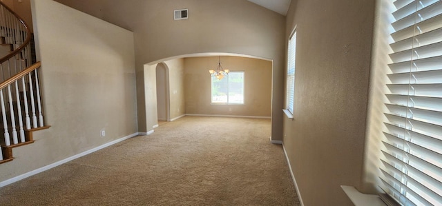 5360 E Heaton Ave, Fresno, CA 93727 - carpeted spare room featuring arched walkways, a chandelier, stairway, high vaulted ceiling, and baseboards