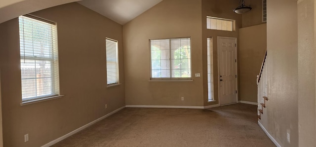 5360 E Heaton Ave, Fresno, CA 93727 - carpeted entryway featuring arched walkways, baseboards, healthy amount of natural light, and vaulted ceiling