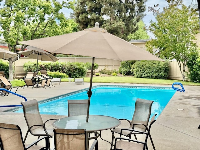 view of pool featuring a fenced in pool, a patio area, and fence
