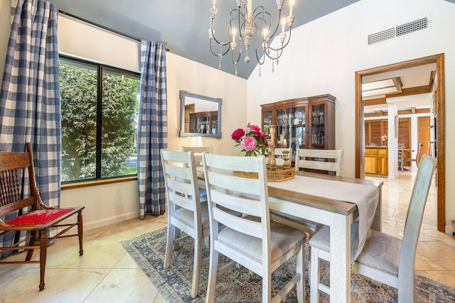 2827 W Compton Ct, Fresno, CA 93711 - dining area with visible vents, a towering ceiling, baseboards, a chandelier, and light tile patterned floors