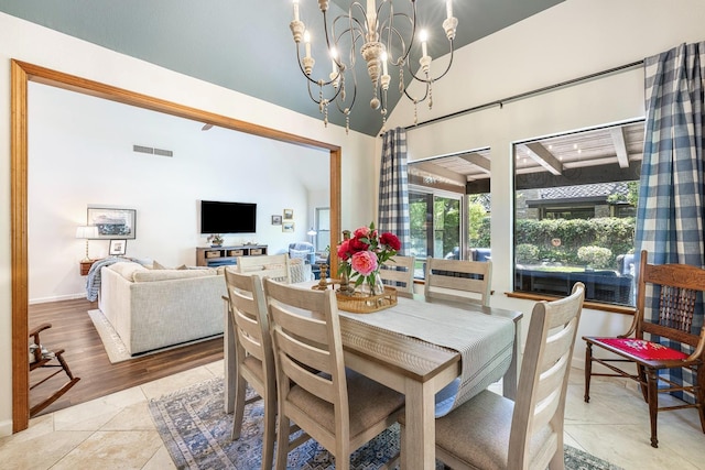 2827 W Compton Ct, Fresno, CA 93711 - dining room featuring visible vents, baseboards, high vaulted ceiling, tile patterned floors, and a chandelier