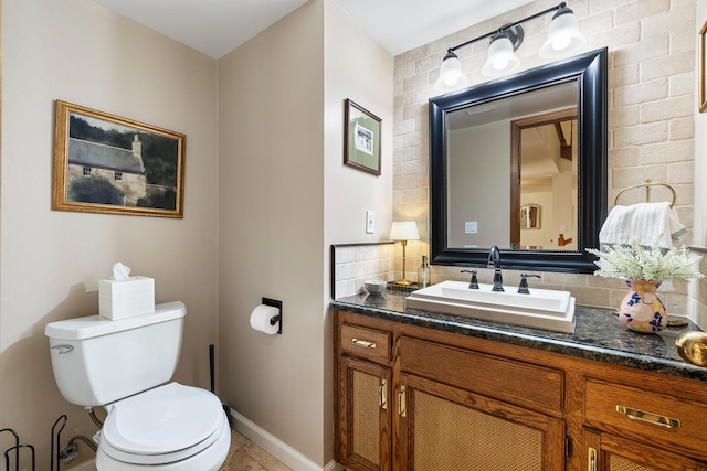 2827 W Compton Ct, Fresno, CA 93711 - half bath with vanity, decorative backsplash, tile patterned flooring, toilet, and baseboards