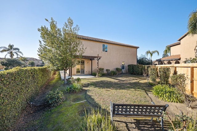 11340 N Via Verona Way, Fresno, CA 93730 - rear view of property featuring a pergola, stucco siding, a fenced backyard, a patio, and a yard