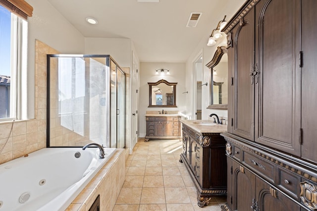11340 N Via Verona Way, Fresno, CA 93730 - bathroom with a jetted tub, visible vents, tile patterned flooring, a stall shower, and a sink
