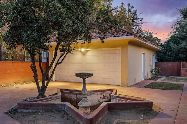2436 N Van Ness Blvd, Fresno, CA 93704 - exterior space featuring a garage, fence, a tile roof, and stucco siding