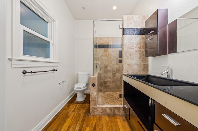 2436 N Van Ness Blvd, Fresno, CA 93704 - full bath featuring vanity, wood finished floors, toilet, baseboards, and a stall shower