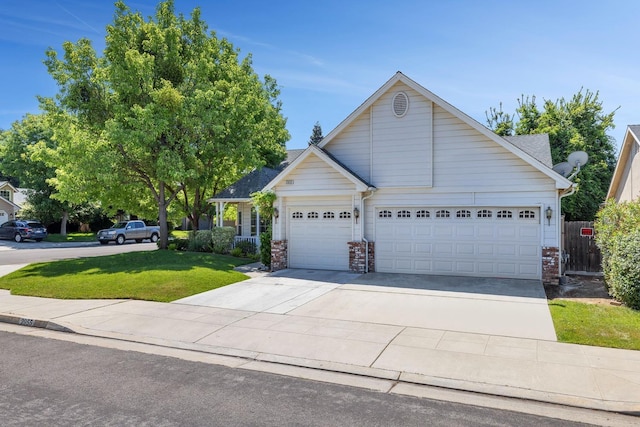 2955 E Christopher, Fresno, CA 93720 - view of front of house with fence, a front yard, brick siding, an attached garage, and driveway