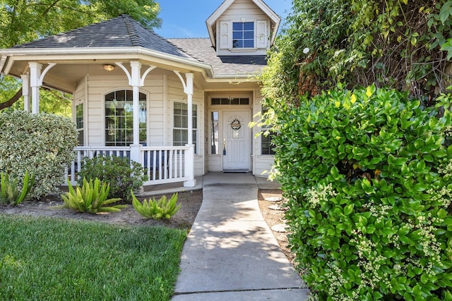 2955 E Christopher, Fresno, CA 93720 - view of exterior entry featuring roof with shingles and covered porch